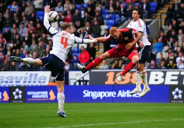 Framed Print : Ryan Taylor's Header at Reebok Stadium: A Pivotal Moment in the 2010-11 Championship Match Between Bolton Wanderers and Bristol City