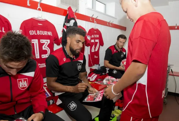 Framed Print : Scott Golbourne of Bristol City Signs Autograph for Mascot in Changing Room during Bristol City v Wigan Athletic Match Framed Print : Scott Golbourne of Bristol City Signs Autograph for Mascot in Changing Room during Bristol City v Wigan Athletic Match