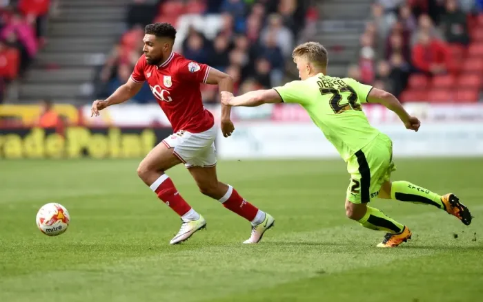 Framed Print : Scott Golbourne Dribbles Past Kyle Dempsey in Bristol City's Sky Bet Championship Clash with Huddersfield Town Framed Print : Scott Golbourne Dribbles Past Kyle Dempsey in Bristol City's Sky Bet Championship Clash with Huddersfield Town