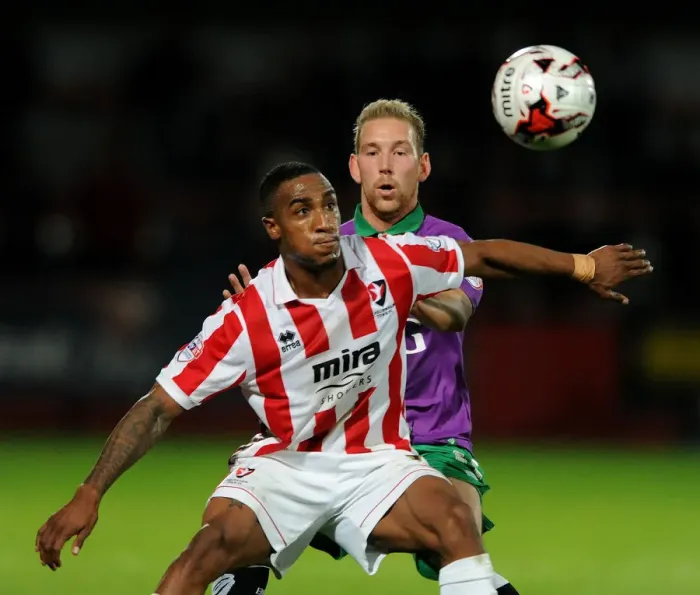 Framed Print : Scott Wagstaff Chases Down Craig Braham-Barrett in Johnstone's Paint Trophy Clash: Intense Moment at Abbey Business Stadium