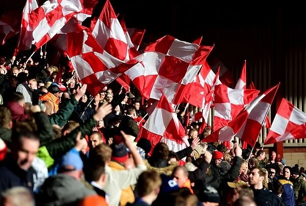 Sea of Flags: Passionate Bristol City Fans Wave Banners at Ashton Gate During Championship Clash vs. Cardiff City (January 2017)