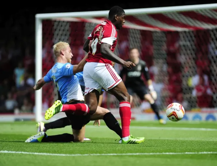 Framed Print : Slick Moves: Jay Emmanuel-Thomas Dodges Andrew Davies at Ashton Gate