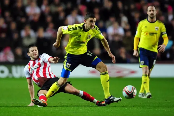 Framed Print : Southampton's Adam Lallana vs. Bristol City's James Wilson: Battle for the Ball in Championship Match, December 2011 Framed Print : Southampton's Adam Lallana vs. Bristol City's James Wilson: Battle for the Ball in Championship Match, December 2011