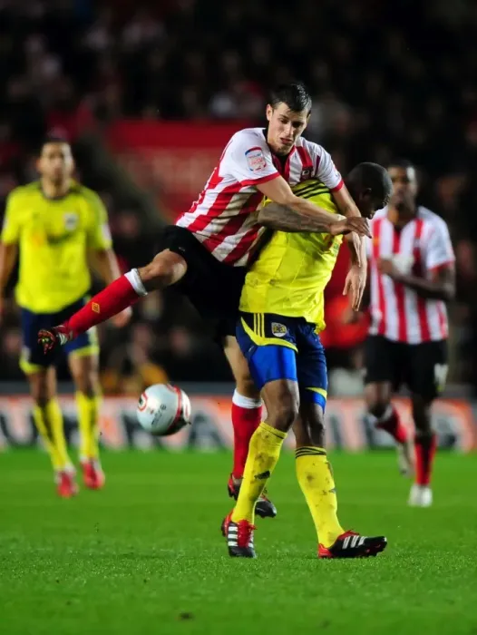 Framed Print : Southampton's Morgan Schneiderlin Fouls Marvin Elliott in Championship Clash between Southampton and Bristol City (30 / 12 / 2011) Framed Print : Southampton's Morgan Schneiderlin Fouls Marvin Elliott in Championship Clash between Southampton and Bristol City (30 / 12 / 2011)