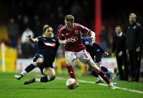 Stephen Pearson Dodges Tackle from Liam Trotter in Championship Match (Bristol City vs Millwall, 03 / 01 / 2012)