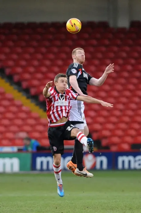 Framed Print : Stephen Pearson vs Stefan Scougall: Intense Battle for the Ball in Sheffield United vs Bristol City Football Match, February 2014 Framed Print : Stephen Pearson vs Stefan Scougall: Intense Battle for the Ball in Sheffield United vs Bristol City Football Match, February 2014