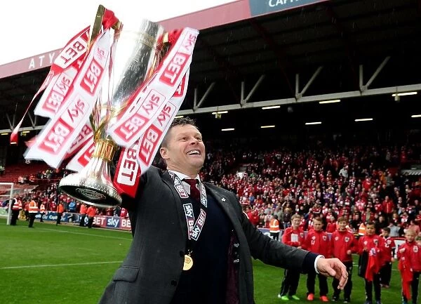 Steve Cotterill Celebrates Double Victory: Sky Bet League One and JPT Trophies with Bristol City