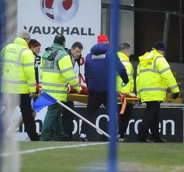 Steve Cotterill Comforts Injured Marvin Elliott: Oldham Athletic vs. Bristol City, 08-02-2014