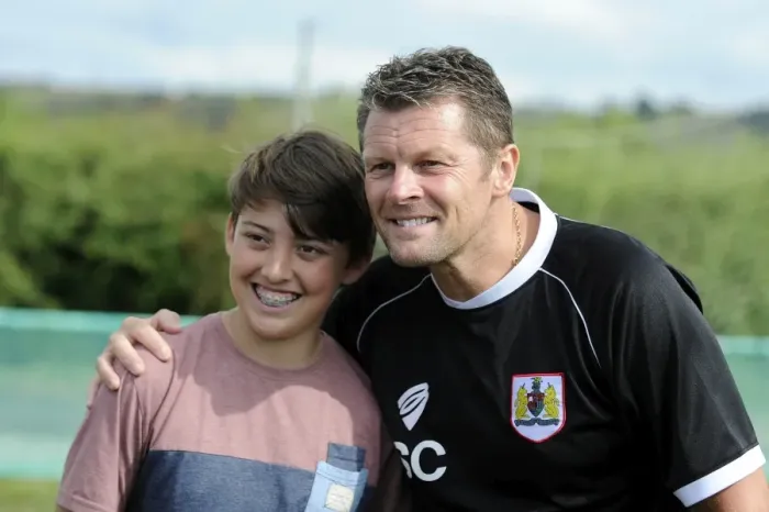 Framed Print : Steve Cotterill Connects with Young Fan at Portishead Town vs. Bristol City Match, 2014