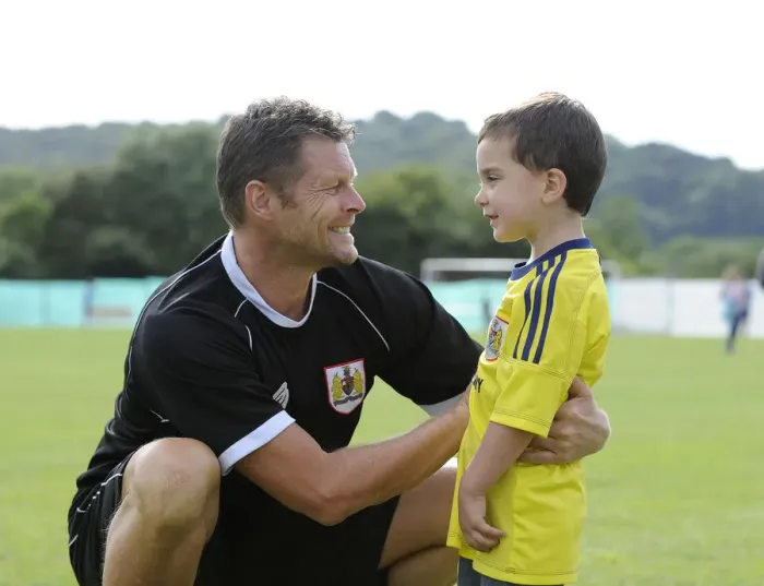 Framed Print : Steve Cotterill Engages with Young Fan at Portishead Town vs. Bristol City Match Framed Print : Steve Cotterill Engages with Young Fan at Portishead Town vs. Bristol City Match