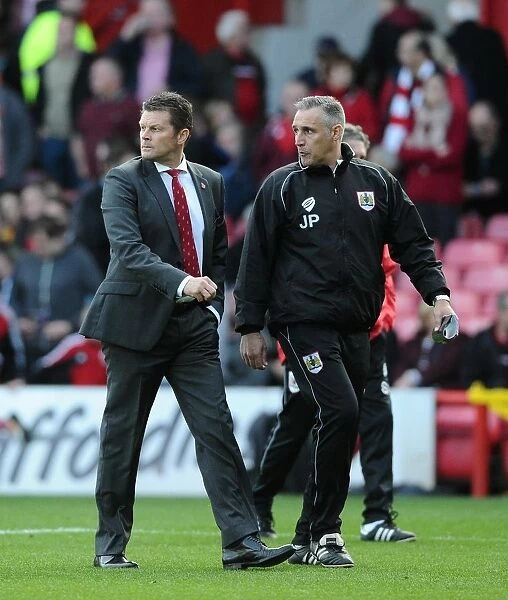 Steve Cotterill and John Pemberton Leading the Charge: Bristol City Football Club vs Oldham Athletic, Sky Bet League One, 2014