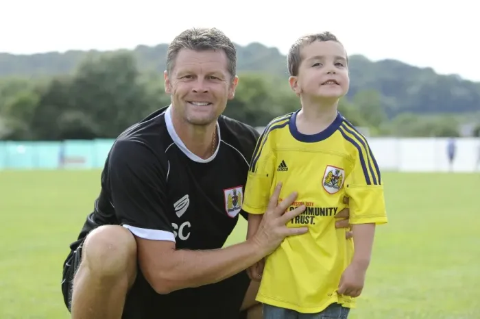 Framed Print : Steve Cotterill and Young Fan Share a Moment at Portishead Town's The Playing Fields During Pre-Season Friendly Against Bristol City