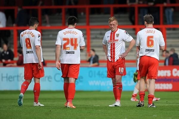 Stevenage players cut dejected figures after the game as they lose 1 - 3 to Bristol City resulting in them being