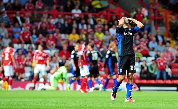 Surprise on the Post: Tal Ben Haim Reacts as Luke Varney's Shot Hits the Woodwork in Bristol City vs. Portsmouth Championship Match (2008-11)