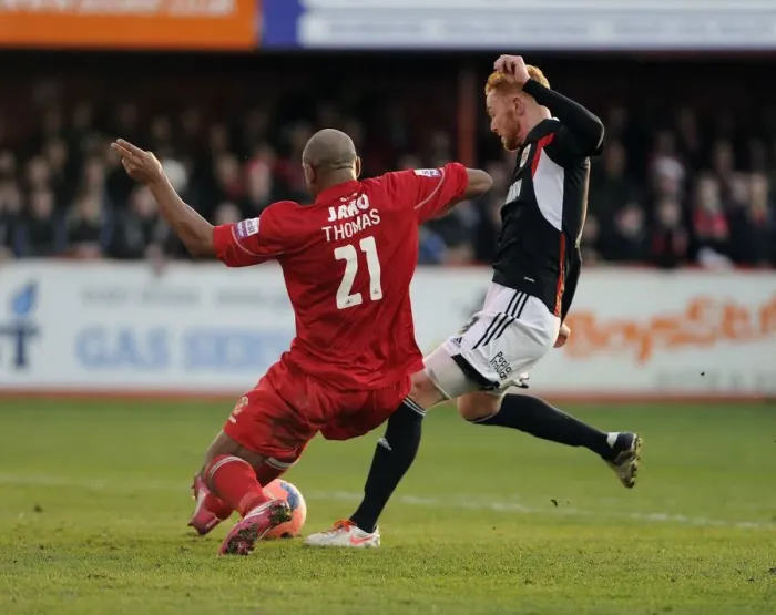 Framed Print : Tamworth's Wayne Thomas Blocks Ryan Taylor's Shot – FA Cup Second Round Tussle at Tamworth's The Lamb Ground Framed Print : Tamworth's Wayne Thomas Blocks Ryan Taylor's Shot – FA Cup Second Round Tussle at Tamworth's The Lamb Ground