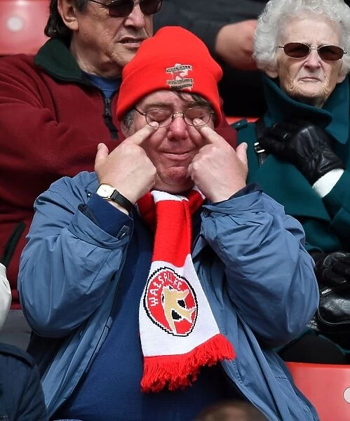 Tense Moment at Ashton Gate: A Walsall Supporter's Intense Expression during the Sky Bet League One Match between Bristol City and Walsall