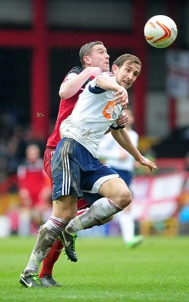 A Tense Moment Between Steven Davies and Craig Dawson: Bristol City vs. Bolton Wanderers