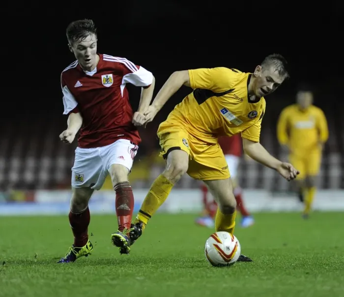 Framed Print : Tense Rivalry: Young Stars Clash in Bristol City U18s vs Newport County U18s Football Match - Jamie Horgan vs Lewis Holmes