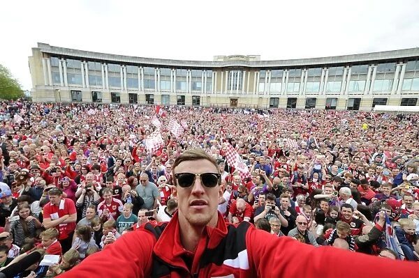Thousands Gather for Bristol City's Celebration Tour: Aden Flint Takes a Selfie with Fans