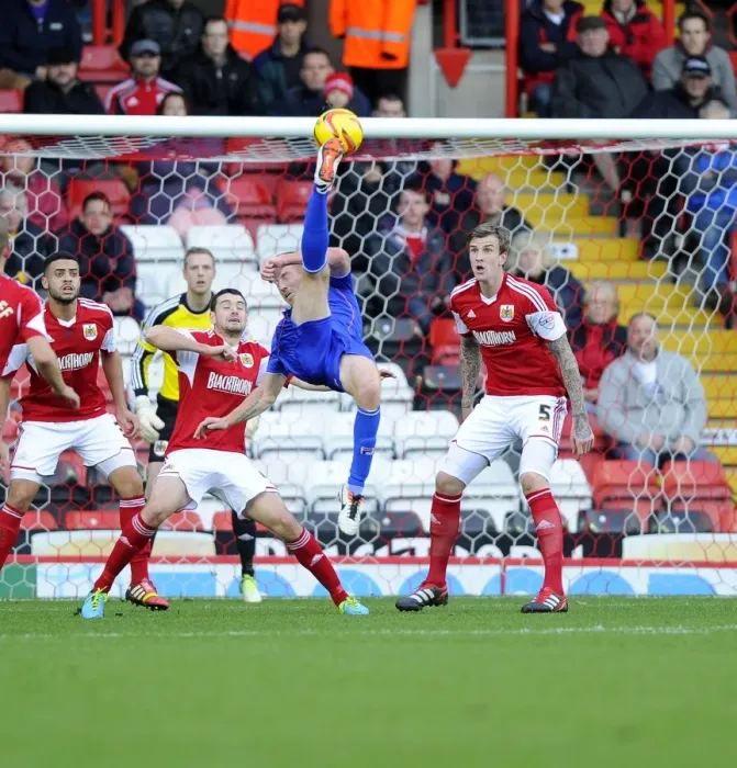 Framed Print : Tight Call: Rooney's Overhead Kick Nearly Scores for Oldham Against Bristol City