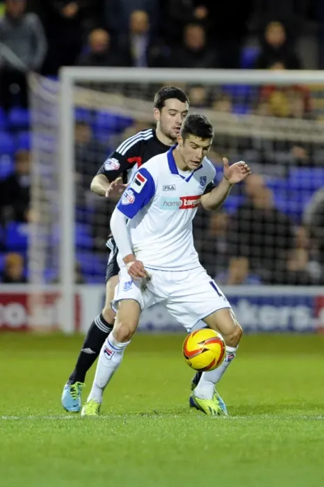 Framed Print : Tranmere's Jake Kirby Holds Off Brendan Moloney of Bristol City in Sky Bet League One Clash at Prenton Park