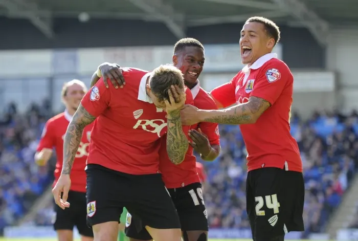 Framed Print : Triumphant Threesome: Aden Flint, Kieran Agard, and James Tavernier Celebrate Winning Goal for Bristol City vs Chesterfield (April 2015)