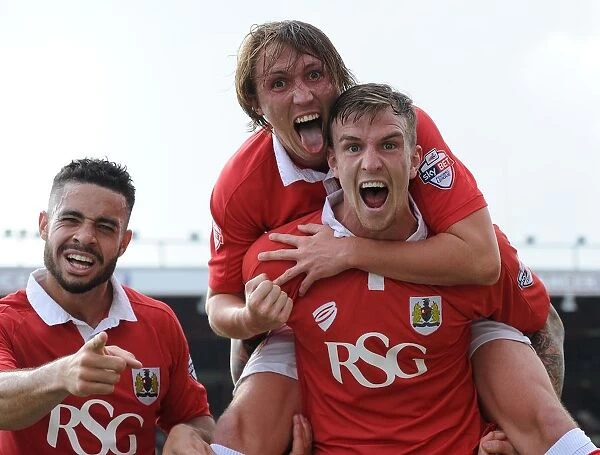 Triumphant Threesome: Aden Flint, Luke Ayling, and Derrick Williams Euphoric Celebration (Bristol City Football Club)