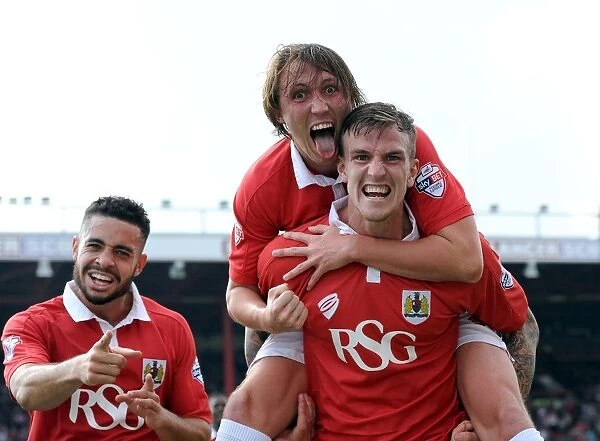 Triumphant Threesome: Flint, Ayling, and Williams Celebrate Goal in Bristol City's Victory over Scunthorpe United (September 6, 2014)