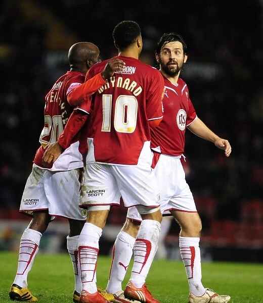 Triumphant Trio: Nicky Maynard, Jamal Campbell-Ryce, and Paul Hartley's Euphoric Moment after Scoring in Bristol City's Victory over Barnsley (23 / 03 / 2010)