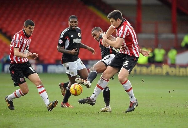 Tyrone Barnett vs. Harry Maguire: Intense Battle for the Ball in Sheffield United vs. Bristol City Football Match, 2014