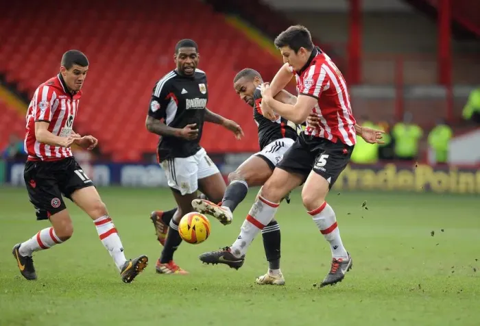 Framed Print : Tyrone Barnett vs. Harry Maguire: Intense Battle for the Ball in Sheffield United vs. Bristol City Football Match, 2014 Framed Print : Tyrone Barnett vs. Harry Maguire: Intense Battle for the Ball in Sheffield United vs. Bristol City Football Match, 2014