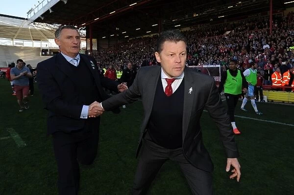 Unforgettable League Victory: Cotterill and Mowbray Embrace Amidst Euphoric Fan Celebrations at Ashton Gate
