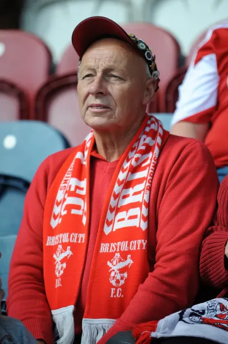 Framed Print : Unwavering Support: A Bristol City Fan Amidst the Action at Rochdale vs. Bristol City (Sky Bet League One, August 2014)