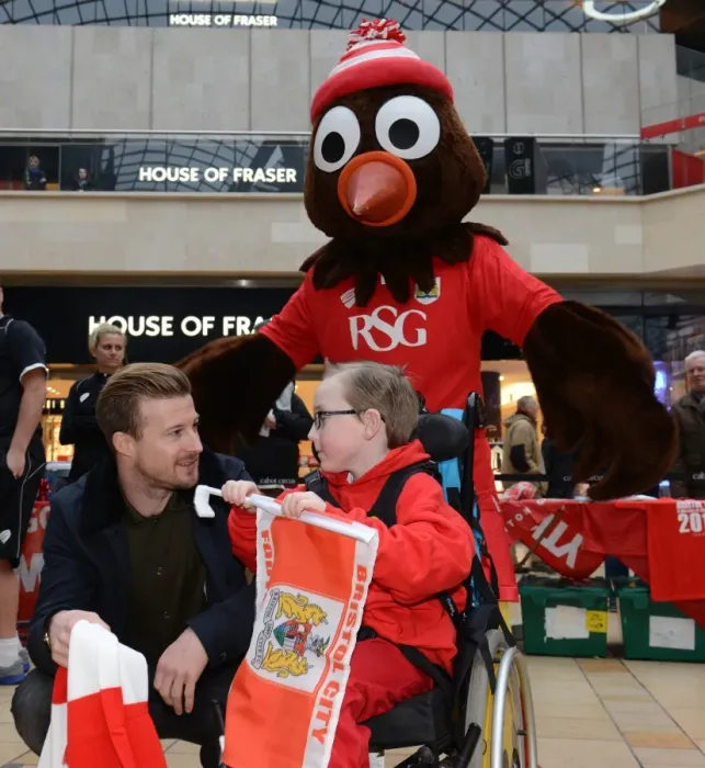 Framed Print : Wade Elliott of Bristol City Engages with Oskar at Cabot Circus during Johnstones Paint Trophy Match, 2015 Framed Print : Wade Elliott of Bristol City Engages with Oskar at Cabot Circus during Johnstones Paint Trophy Match, 2015