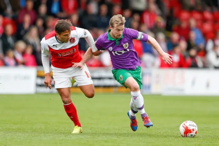 Framed Print : Wade Elliott vs Antoni Sarcevic: Intense Battle in Fleetwood Town vs Bristol City Football Match, 2014