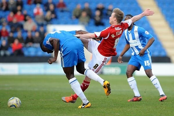 Wade Elliott vs Magnus Okuonghae: Intense Battle for the Ball in Colchester United vs Bristol City Football Match, Sky Bet League One, 2014
