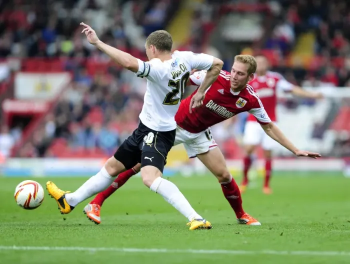 Framed Print : Wagstaff vs Wilson: Intense Clash Between Bristol City's Scott Wagstaff and Colchester United's Brian Wilson at Ashton Gate, Sky Bet League One