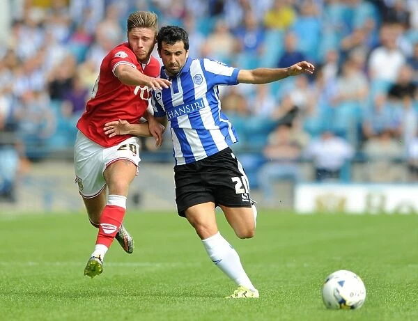 Wes Burns vs. Alex Lopez: Battle for Ball Possession in Sheffield Wednesday vs. Bristol City Championship Clash