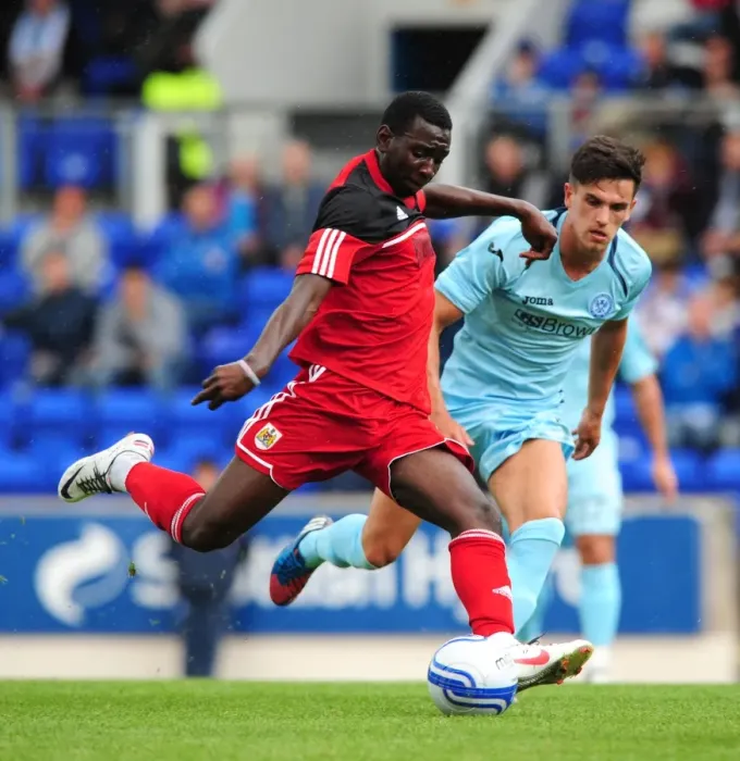 Framed Print : Yannick Bolasie's Long-Range Shot: St Johnstone vs. Bristol City Pre-Season Friendly, 2012 Framed Print : Yannick Bolasie's Long-Range Shot: St Johnstone vs. Bristol City Pre-Season Friendly, 2012