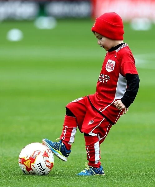 Young Bristol City Fan Assists Players with Footballs during Barnsley vs. Bristol City Match, Oakwell Stadium, 2016