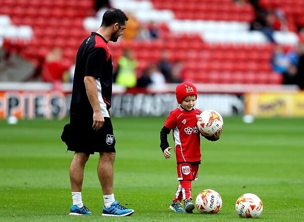 Young Bristol City Fan Helps Out at Oakwell Stadium During Barnsley vs. Bristol City Match