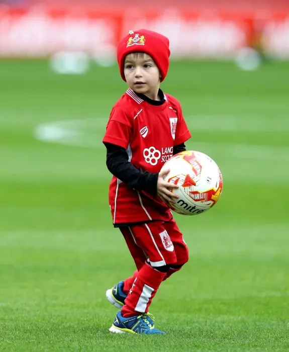 Framed Print : Young Bristol City Fan Invited onto Oakwell Pitch for Football Collection during Barnsley vs. Bristol City Match
