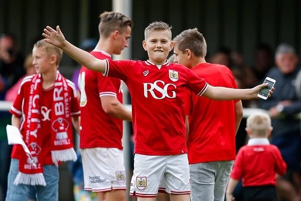 Young Bristol City Fans Jubilant Post-Match Pitch Invasion: A Warm End to the Community Match