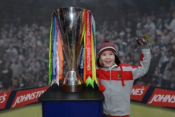 Young Fan Celebrates with JPT Trophy at Cabot Circus
