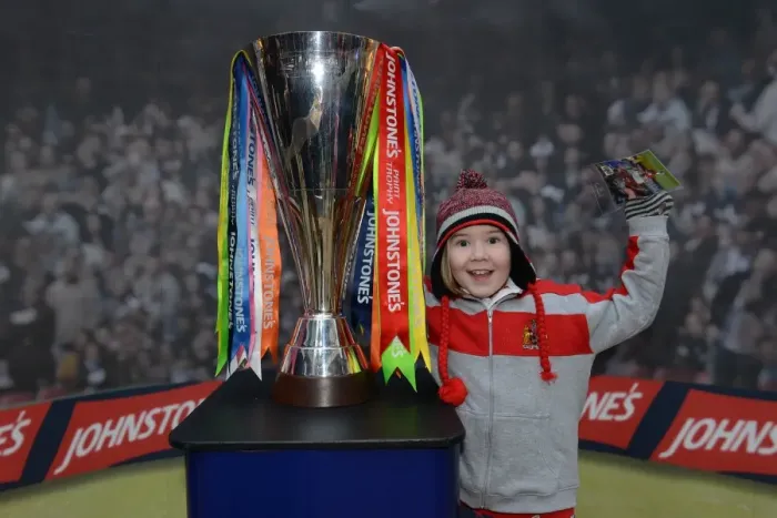 Framed Print : Young Fan Celebrates with JPT Trophy at Cabot Circus