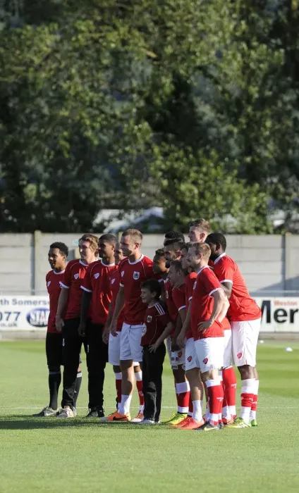 Framed Print : Young Fan Meets Bristol City Squad at Weston Super Mare's Woodspring Stadium Framed Print : Young Fan Meets Bristol City Squad at Weston Super Mare's Woodspring Stadium