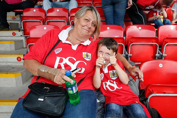A Young Fan's Excitement: Fleetwood Town vs. Bristol City Football Match, 2014