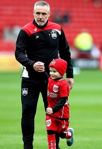 Young Fan's Exciting Moment with Bristol City Coach John Pemberton at Oakwell Stadium