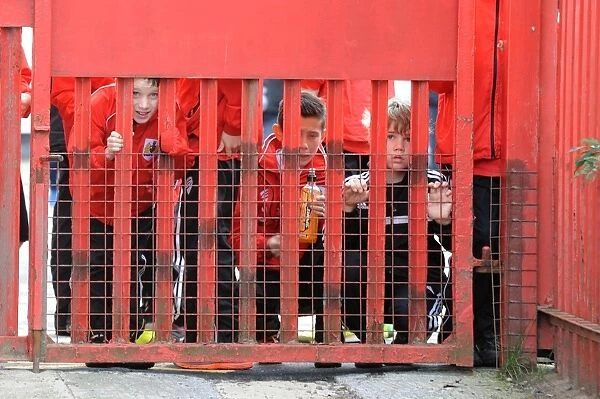 Young Fans Peek at Bristol City vs Oldham Athletic Football Match, 2014