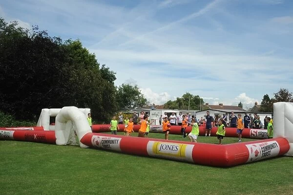 Young Fans Play Football on Inflatable Pitch Before Portishead Town vs. Bristol City Match